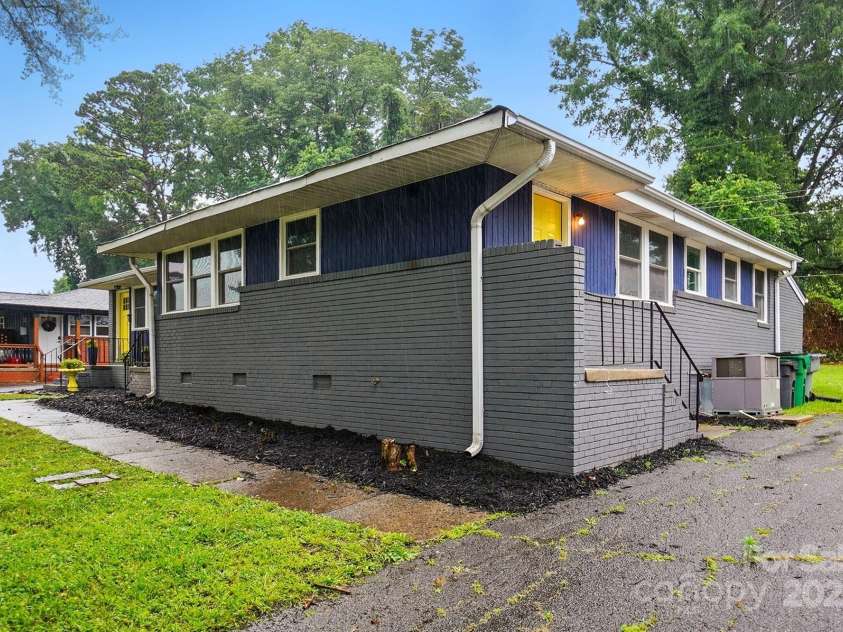 1412 Wembley Drive, Charlotte, NC 28205.  MLS# CAR4257976, YatesRealty ID 20281. Driveway and side entrance for 3bdrm unit