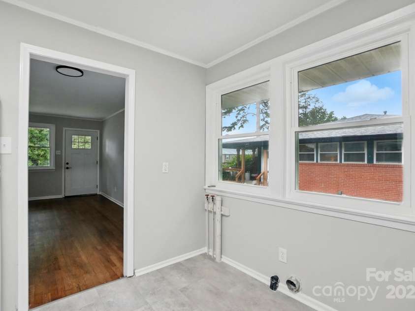 1412 Wembley Drive, Charlotte, NC 28205.  MLS# CAR4257976, YatesRealty ID 20281. Washer dryer hookups in kitchen