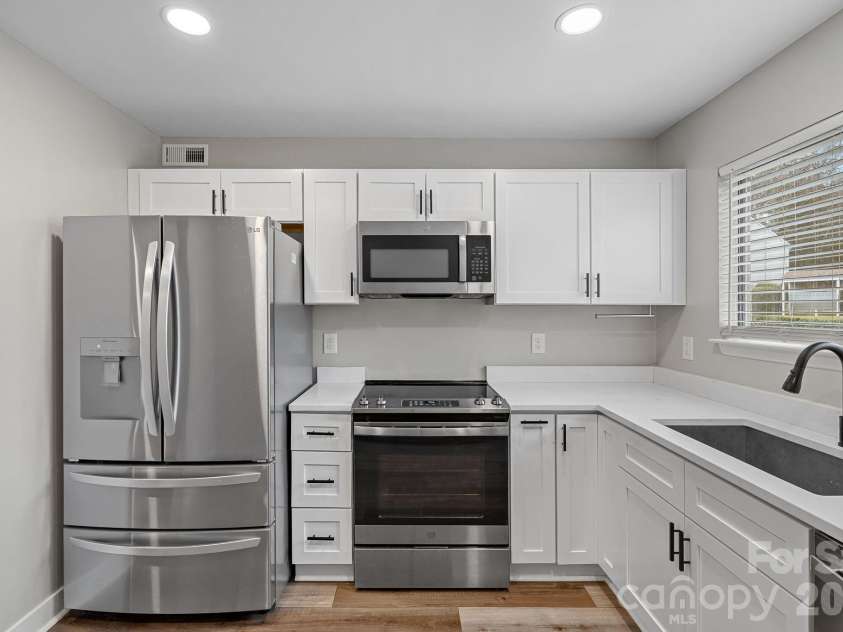 3021 Heathstead Place, Charlotte, NC 28210.  MLS# CAR4358212, YatesRealty ID 20285. Counters, all cabinets, appliances and recessed lighting updated