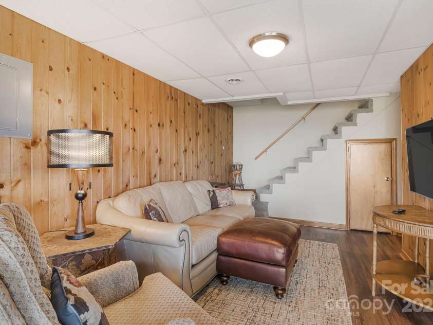 871 Rich Knob Road, Little Switzerland, NC 28749.  MLS# CAR4263972, YatesRealty ID 20293. Basement den