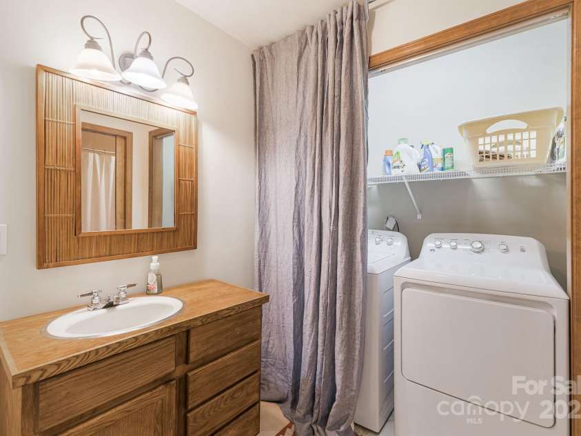 871 Rich Knob Road, Little Switzerland, NC 28749.  MLS# CAR4263972, YatesRealty ID 20293. Primary bath with laundry