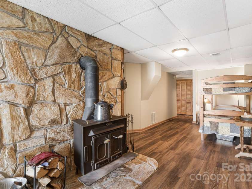 871 Rich Knob Road, Little Switzerland, NC 28749.  MLS# CAR4263972, YatesRealty ID 20293. There's that massive stone fireplace!