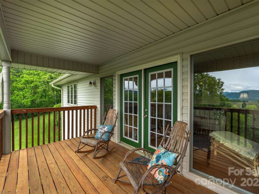 59 Grace Ridge Road, Waynesville, NC 28786.  MLS# CAR4265634, YatesRealty ID 20298. Front deck off living room