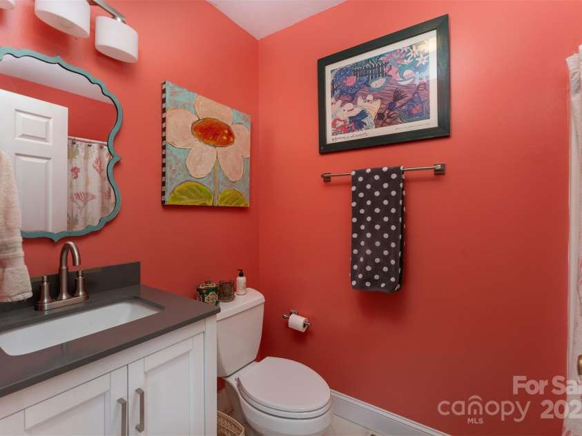 59 Grace Ridge Road, Waynesville, NC 28786.  MLS# CAR4265634, YatesRealty ID 20298. Guest bath with tub/shower