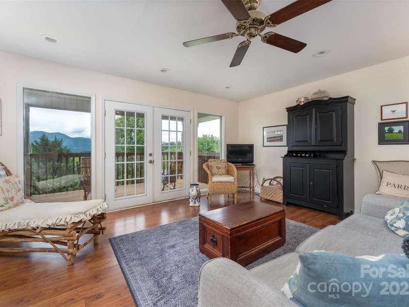 59 Grace Ridge Road, Waynesville, NC 28786.  MLS# CAR4265634, YatesRealty ID 20298. Living room looking at those beautiful mountains