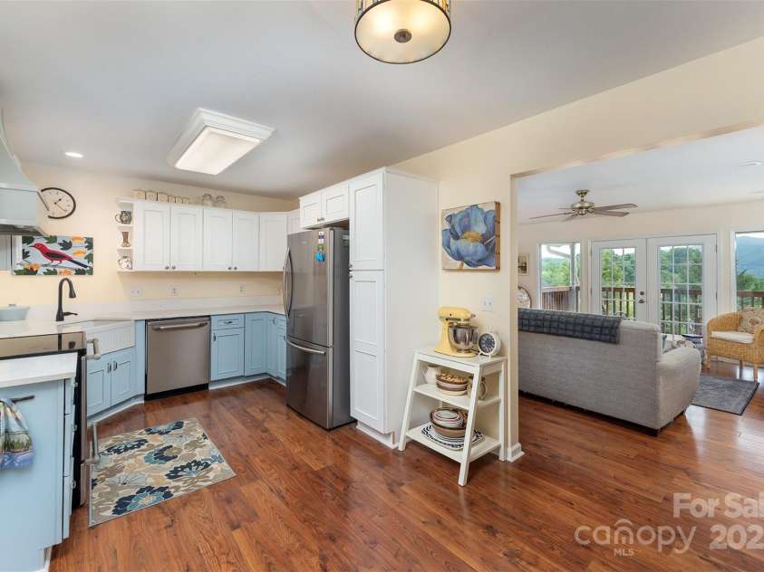 59 Grace Ridge Road, Waynesville, NC 28786.  MLS# CAR4265634, YatesRealty ID 20298. View from back door into living room area & kitchen