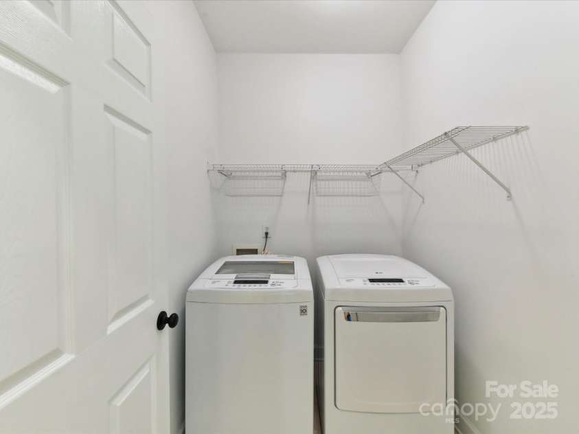 2215 Henery Tuckers Court, Charlotte, NC 28270.  MLS# CAR4267429, YatesRealty ID 20299. A laundry room is conveniently located on the main level.