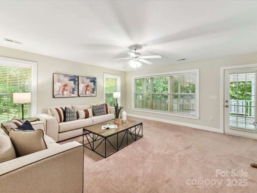 2215 Henery Tuckers Court, Charlotte, NC 28270.  MLS# CAR4267429, YatesRealty ID 20299. A spacious den located in the basement is another wonderful hangout space.
