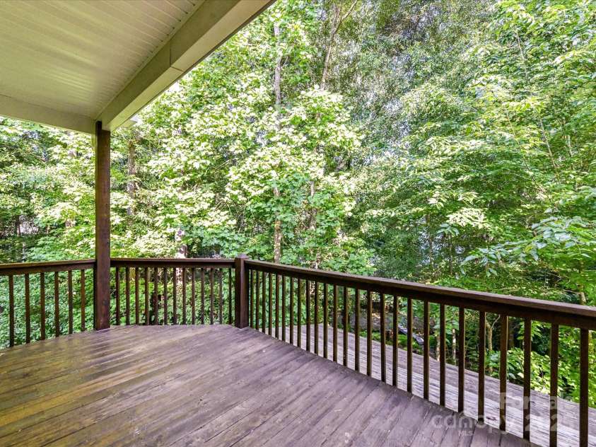 2215 Henery Tuckers Court, Charlotte, NC 28270.  MLS# CAR4267429, YatesRealty ID 20299. Back deck that overlooks a wooded setting