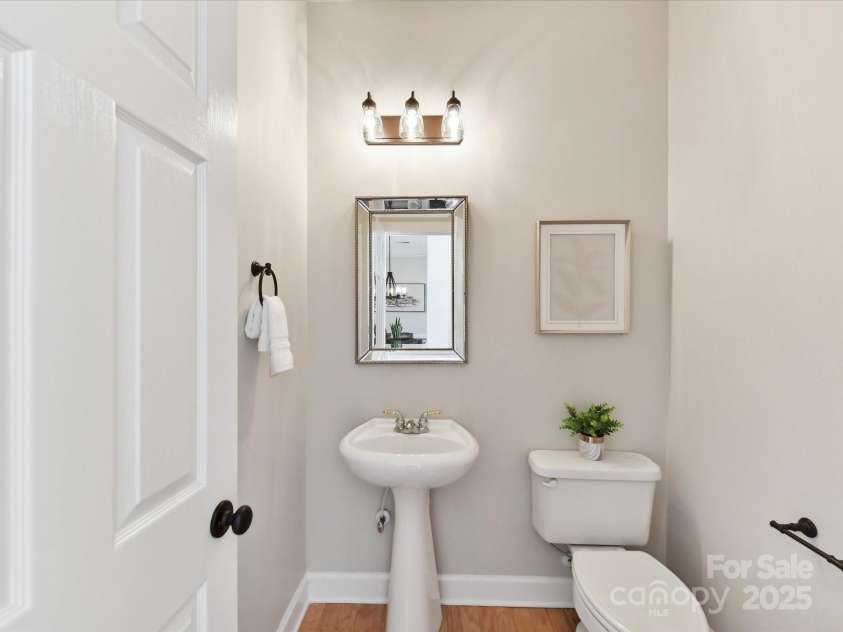 2215 Henery Tuckers Court, Charlotte, NC 28270.  MLS# CAR4267429, YatesRealty ID 20299. The powder room on the main level