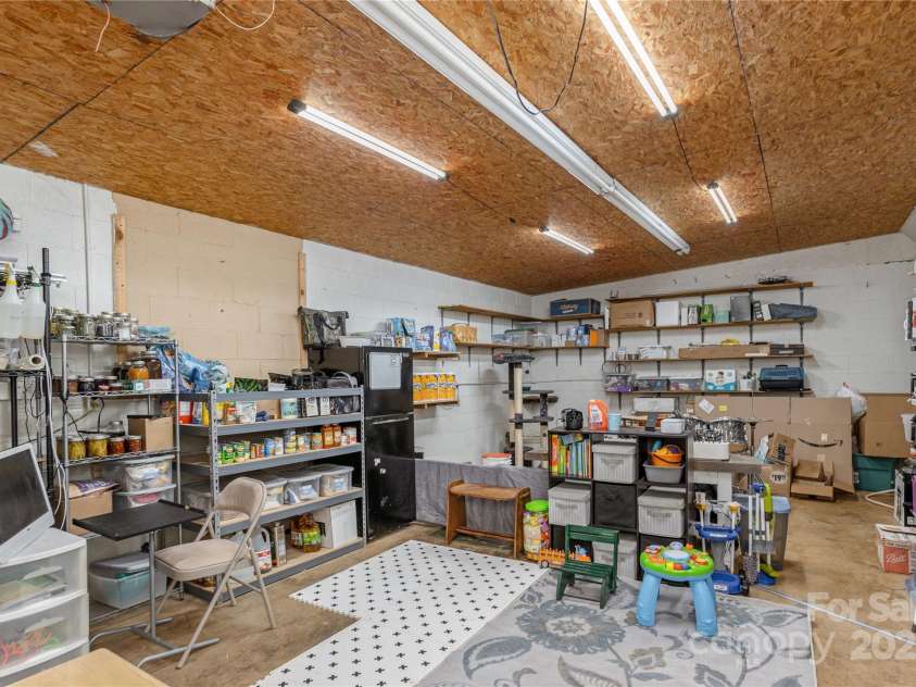 236 Why Worry Boulevard, Canton, NC 28716.  MLS# CAR4235759, YatesRealty ID 20301. One car garage currently used for play area and storage.