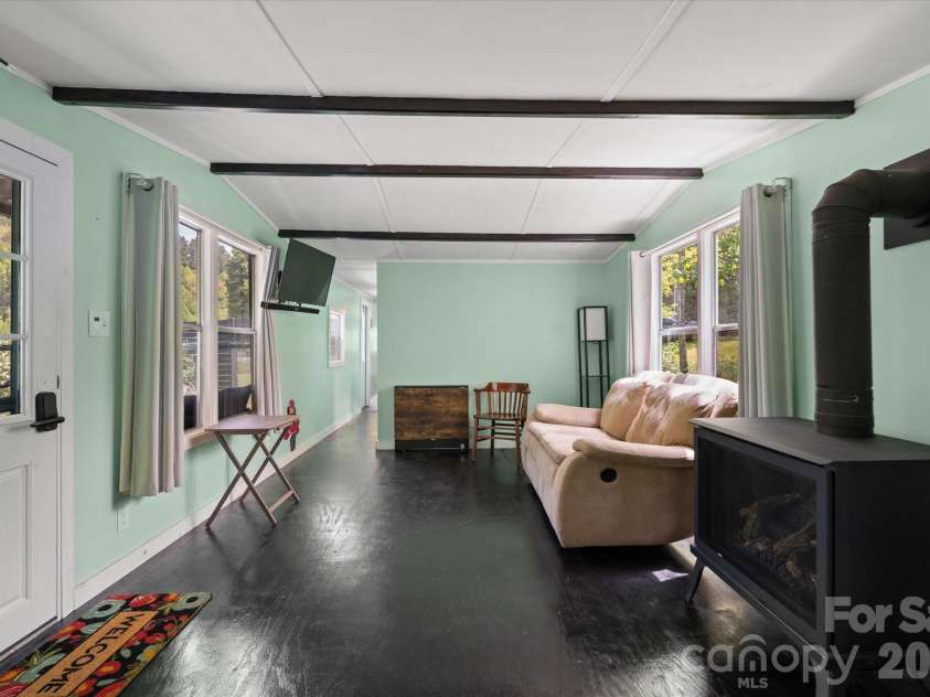 72 Amos Creek Road, Marshall, NC 28753.  MLS# CAR4379561, YatesRealty ID 20302. Open living area allows for entertaining.