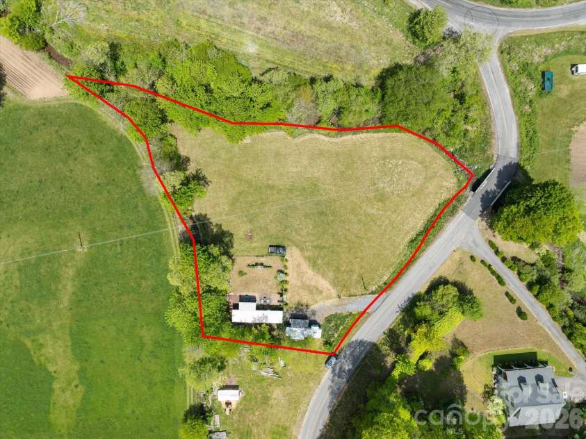 72 Amos Creek Road, Marshall, NC 28753.  MLS# CAR4379561, YatesRealty ID 20302. Over 1 acre bordered by 2 creeks