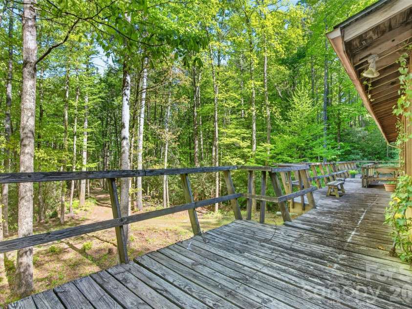 451 Signal Tree Road, Deep Gap, NC 28618.  MLS# CAR4374563, YatesRealty ID 20306. Den with two sliding glass doors providing access to the wraparound deck. 
