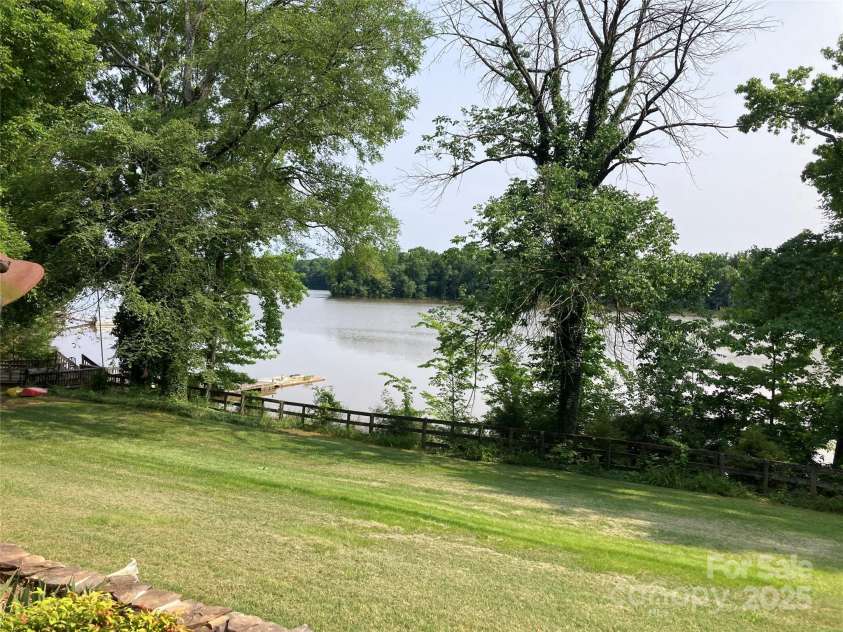 1433 Kern Carlton Road, Salisbury, NC 28146.  MLS# CAR4263758, YatesRealty ID 20307. Backbyard over looking lake.