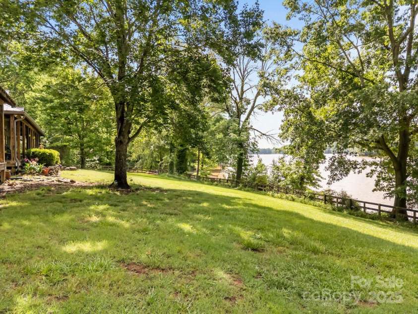 1433 Kern Carlton Road, Salisbury, NC 28146.  MLS# CAR4263758, YatesRealty ID 20307. Yard over looking Lake