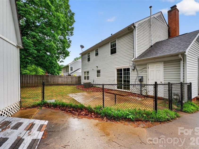621 Winter Wood Drive, Matthews, NC 28105.  MLS# CAR4376332, YatesRealty ID 20308. Backyard entry