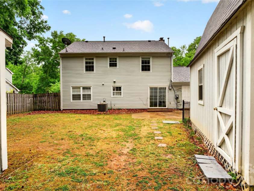 621 Winter Wood Drive, Matthews, NC 28105.  MLS# CAR4376332, YatesRealty ID 20308. Backyard Paradise