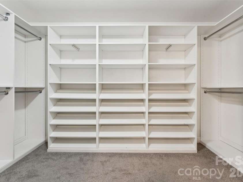 6934 Evanton Loch Road, Charlotte, NC 28278.  MLS# CAR4423258, YatesRealty ID 20316. Check out this custom master bedroom closet…