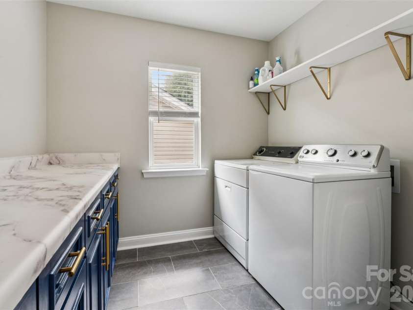 6934 Evanton Loch Road, Charlotte, NC 28278.  MLS# CAR4423258, YatesRealty ID 20316. Large laundry room w/great folding table area..
