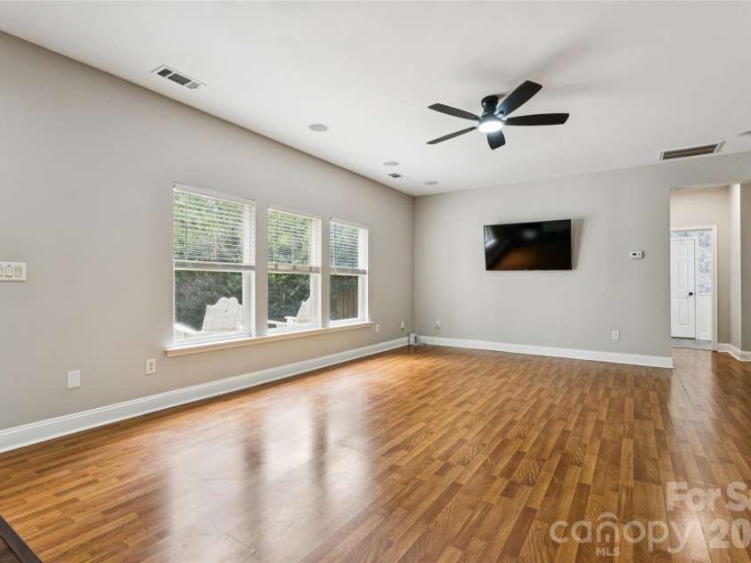 6934 Evanton Loch Road, Charlotte, NC 28278.  MLS# CAR4423258, YatesRealty ID 20316. Open great room w/fireplace perfect for the fall!