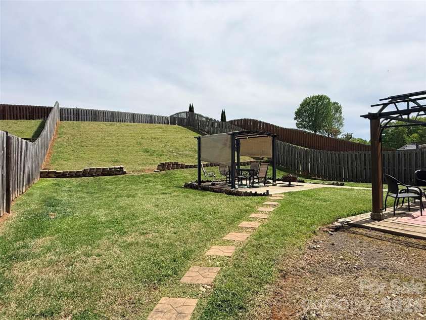 7910 Sweet Grove Court, Charlotte, NC 28269.  MLS# CAR4331516, YatesRealty ID 20319. Ginormous Backyard!