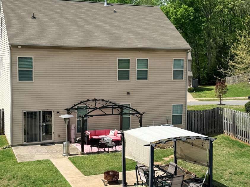 7910 Sweet Grove Court, Charlotte, NC 28269.  MLS# CAR4331516, YatesRealty ID 20319. Two patios - Entertainment space for all