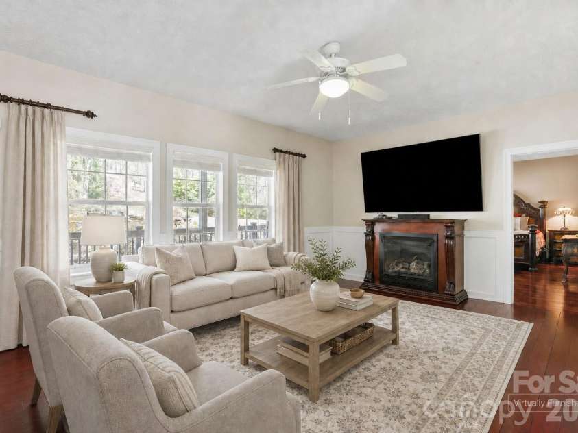 10 Eagle Drive, Hendersonville, NC 28792.  MLS# CAR4365502, YatesRealty ID 20321. Bright family room with fireplace