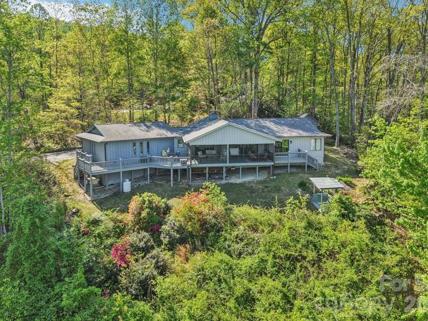 817 Greenwood Drive, Hendersonville, NC 28791.  MLS# CAR4371920, YatesRealty ID 20328. Back View with large deck.