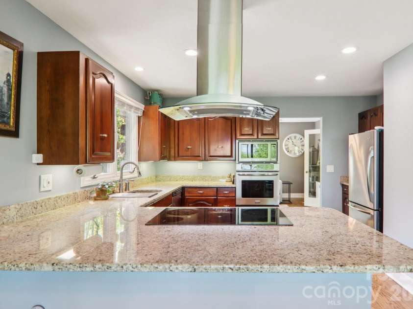 817 Greenwood Drive, Hendersonville, NC 28791.  MLS# CAR4371920, YatesRealty ID 20328. Kitchen with induction stove top