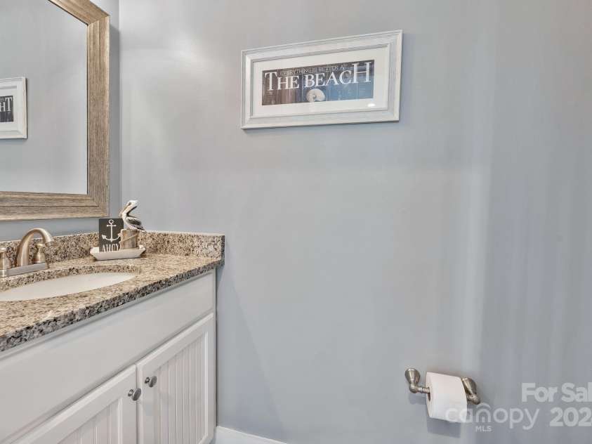 333 Calhoun Drive, Garden City, SC 29576.  MLS# CAR4176788, YatesRealty ID 2033. Half bath off living area on main level