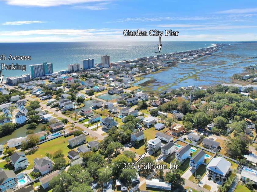 333 Calhoun Drive, Garden City, SC 29576.  MLS# CAR4176788, YatesRealty ID 2033. Located just steps from the beach, and minutes to the Garden City pier, food & entertainment.