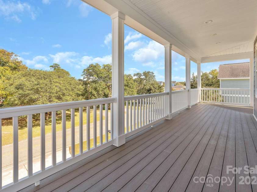 333 Calhoun Drive, Garden City, SC 29576.  MLS# CAR4176788, YatesRealty ID 2033. Upper level wrap around porch facing the ocean.