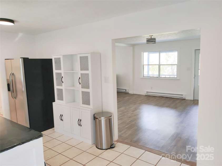 7 and 11 Dalph Drive, Weaverville, NC 28787.  MLS# CAR4315125, YatesRealty ID 2033. Living room and kitchen from sunroom