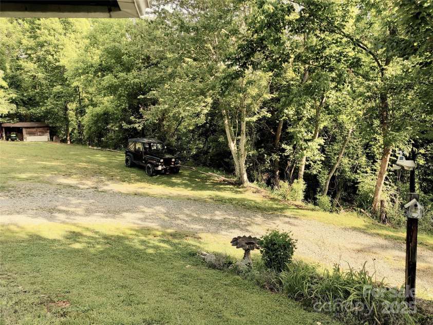 7 and 11 Dalph Drive, Weaverville, NC 28787.  MLS# CAR4315125, YatesRealty ID 2033. Side yard from porch