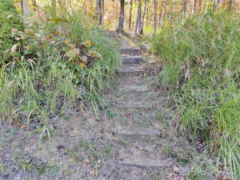 7 and 11 Dalph Drive, Weaverville, NC 28787.  MLS# CAR4315125, YatesRealty ID 2033. Steps going up to woods in back yard