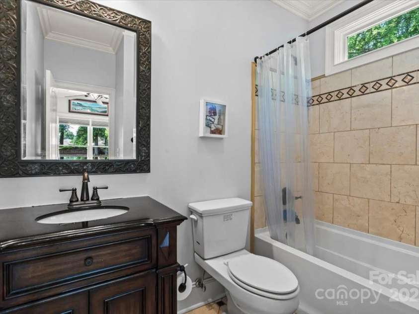 18745 Bluff Point Road, Cornelius, NC 28031.  MLS# CAR4264451, YatesRealty ID 20330. 1st floor bedroom ensuite bathroom