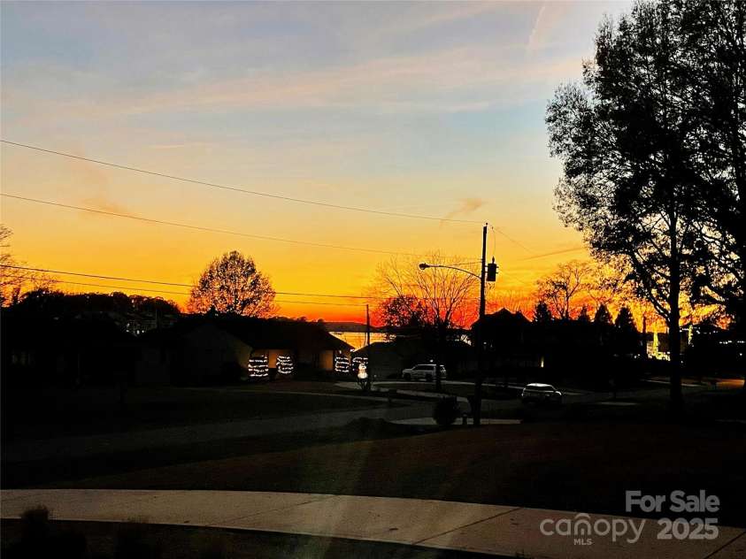 18745 Bluff Point Road, Cornelius, NC 28031.  MLS# CAR4264451, YatesRealty ID 20330. Amazing front porch sunsets!