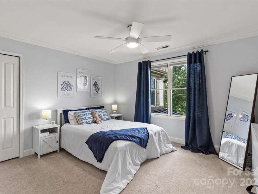 18745 Bluff Point Road, Cornelius, NC 28031.  MLS# CAR4264451, YatesRealty ID 20330. Bedroom 2-has full bathroom ensuite. Lake views