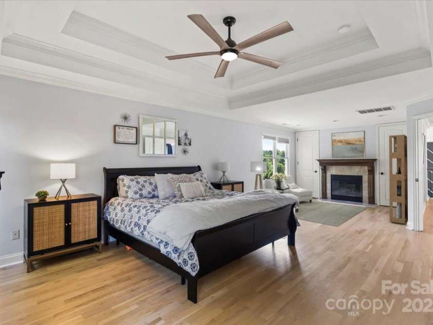 18745 Bluff Point Road, Cornelius, NC 28031.  MLS# CAR4264451, YatesRealty ID 20330. Sitting area in primary bedroom virtually staged