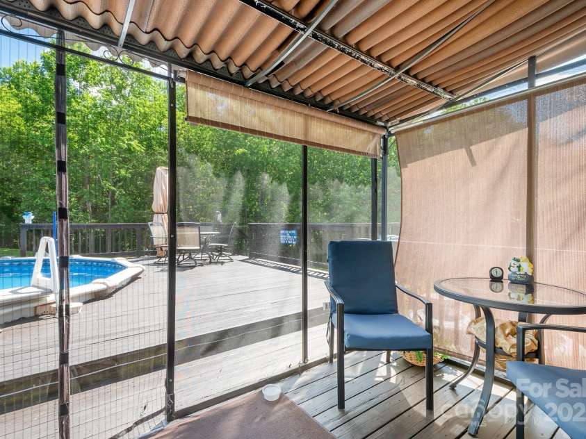 136 Barringer Drive, Statesville, NC 28625.  MLS# CAR4265098, YatesRealty ID 20333. Easy up screened area by pool