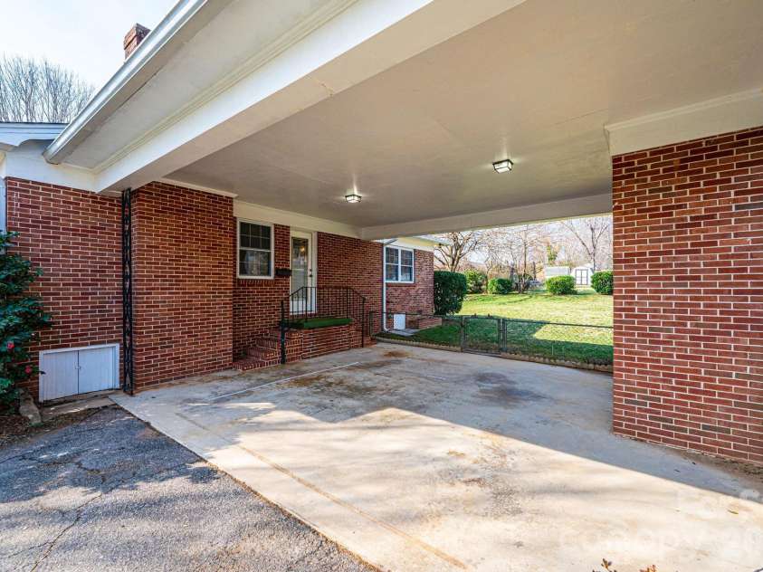 1425 5th Street, Hickory, NC 28601.  MLS# CAR4351835, YatesRealty ID 20337. Side Entrance at Carport