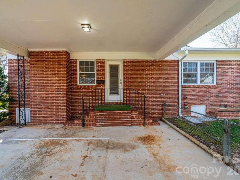 1425 5th Street, Hickory, NC 28601.  MLS# CAR4351835, YatesRealty ID 20337. Side Entrance at Carport