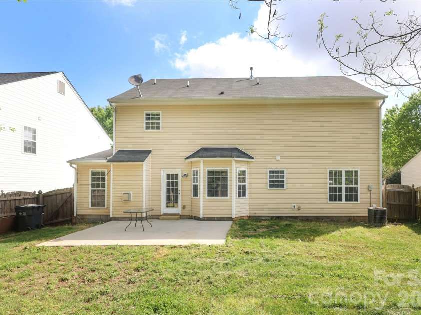10910 Elm Bend Drive, Charlotte, NC 28273.  MLS# CAR4337592, YatesRealty ID 20339. Rear of the home from the backyard.
