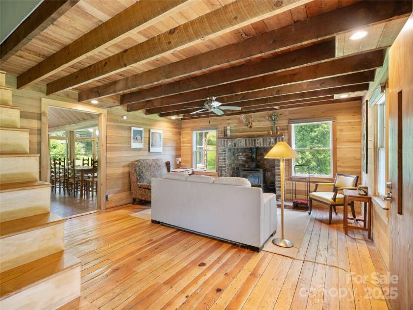 9065 NC 63 Highway, Leicester, NC 28748.  MLS# CAR4286038, YatesRealty ID 2034. Living room