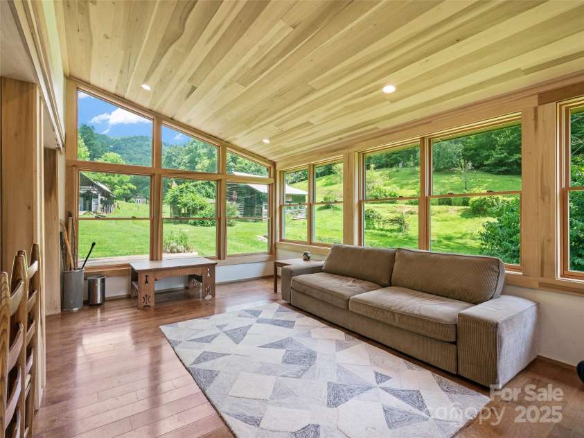 9065 NC 63 Highway, Leicester, NC 28748.  MLS# CAR4286038, YatesRealty ID 2034. Sunroom