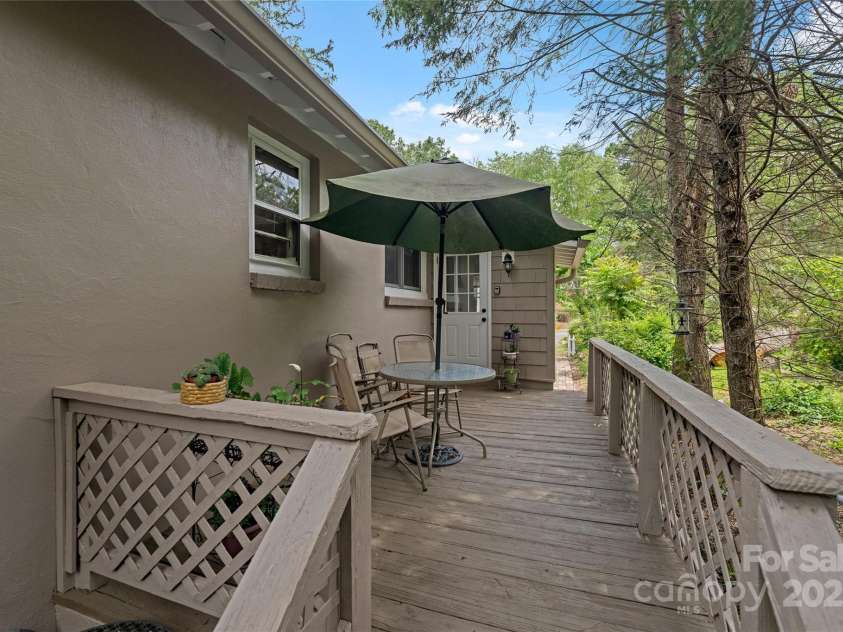 261 Forest Hill Drive, Asheville, NC 28803.  MLS# CAR4269408, YatesRealty ID 20353. Back Porch- shaded and tucked in the trees.