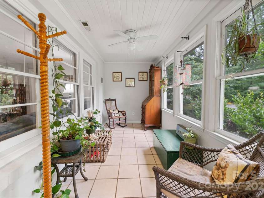 261 Forest Hill Drive, Asheville, NC 28803.  MLS# CAR4269408, YatesRealty ID 20353. Charming light filled sun room