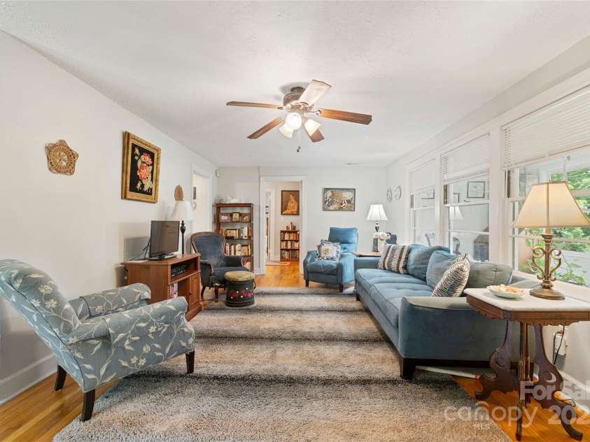 261 Forest Hill Drive, Asheville, NC 28803.  MLS# CAR4269408, YatesRealty ID 20353. Spacious and light filled living room with original hardwood floors