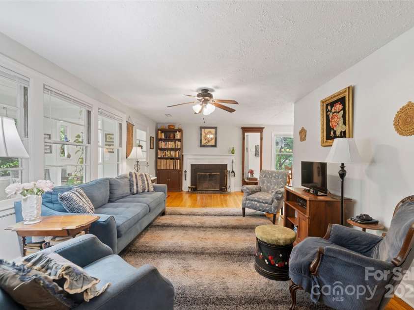 261 Forest Hill Drive, Asheville, NC 28803.  MLS# CAR4269408, YatesRealty ID 20353. Sunroom and front door to the left, dining and kitchen to the right.